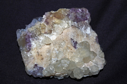 Witherite, calcite and fluorite from Rosiclare, Illinois.  Pictured under white light, long wav