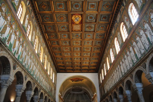 The spectacular interior of the Basilica of Saint Apollinare Nuovo, in Ravenna, Italy.  The mosaics 