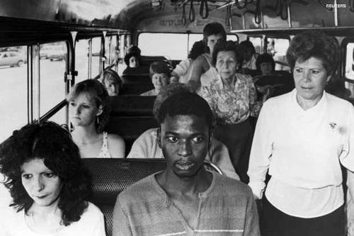  A black man rides a bus restricted to whites only, in Durban. In an act of resistance