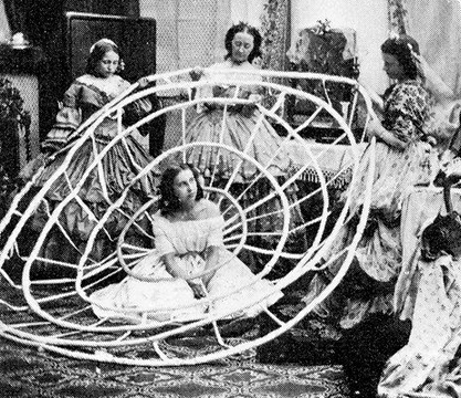 sixpenceee:Demonstration of hoop skirt assembly, 1860This is a set of satirical photos. NOT an accur