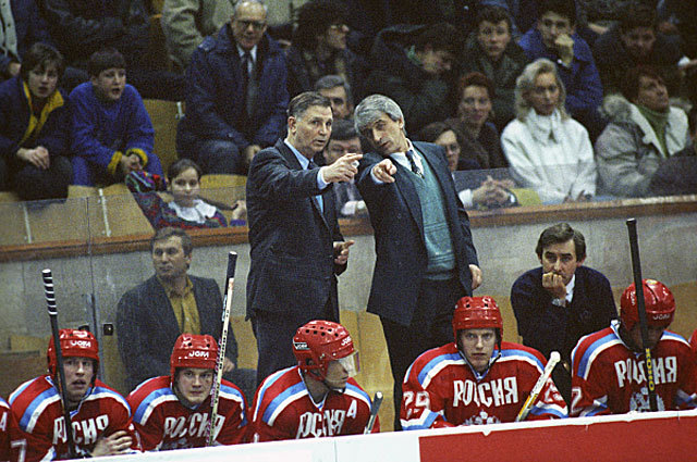 Coaches Viktor Tikhonov (l.) and Igor Dmitriev talk some strategy on the Russian bench in 1993. (Image Source)