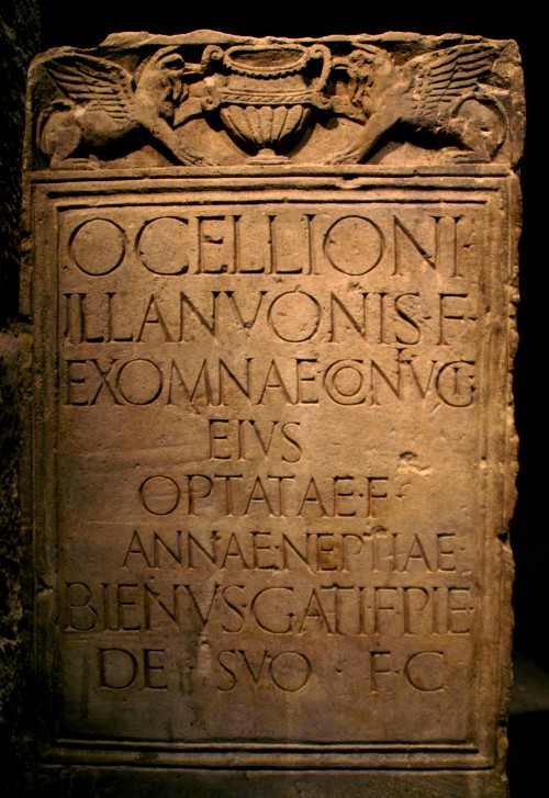 Roman gravestone. Translated, it reads: For Ocellio, son of Illanuo, his wife Exomna, his daughter 