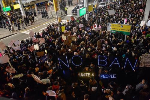 Protesters rally against the Muslim immigration ban during a demonstration at John F. Kennedy Intern