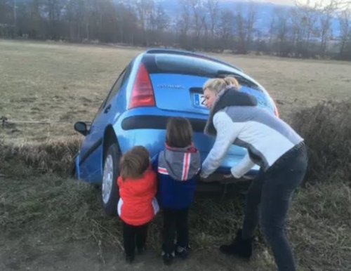 Shakira, Milan, and Sasha helping someone pull their car out of a ditch a few days ago