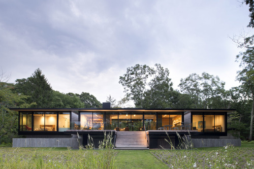 The team of Bates + Masi has rebuilt the site of this East Hampton Classic. The wide living room fea