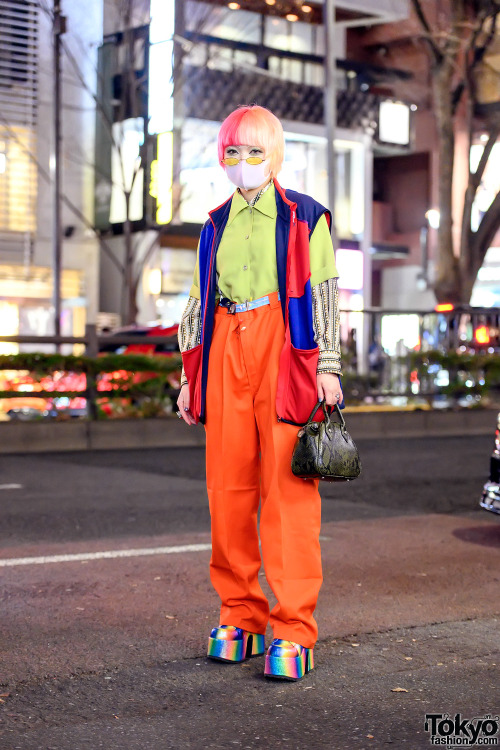 tokyo-fashion:  Masked 14-year-old Japanese student Shiori on the street in Harajuku. She is wearing a vintage colorblock vest from Used Focus over layered shirts, baggy belted pants with safety pins and suspenders, a Faith Tokyo resale handbag, Never