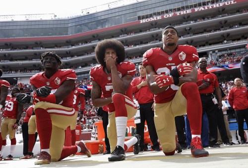 blondebrainpower:Eli Harold, left, Colin Kaepernick, and Eric Reid of the San Francisco 49ers kneel during the national anthem before a game in Santa Clara, Calif., on Oct. 2, 2016. Marcio Jose Sanchez / AP file