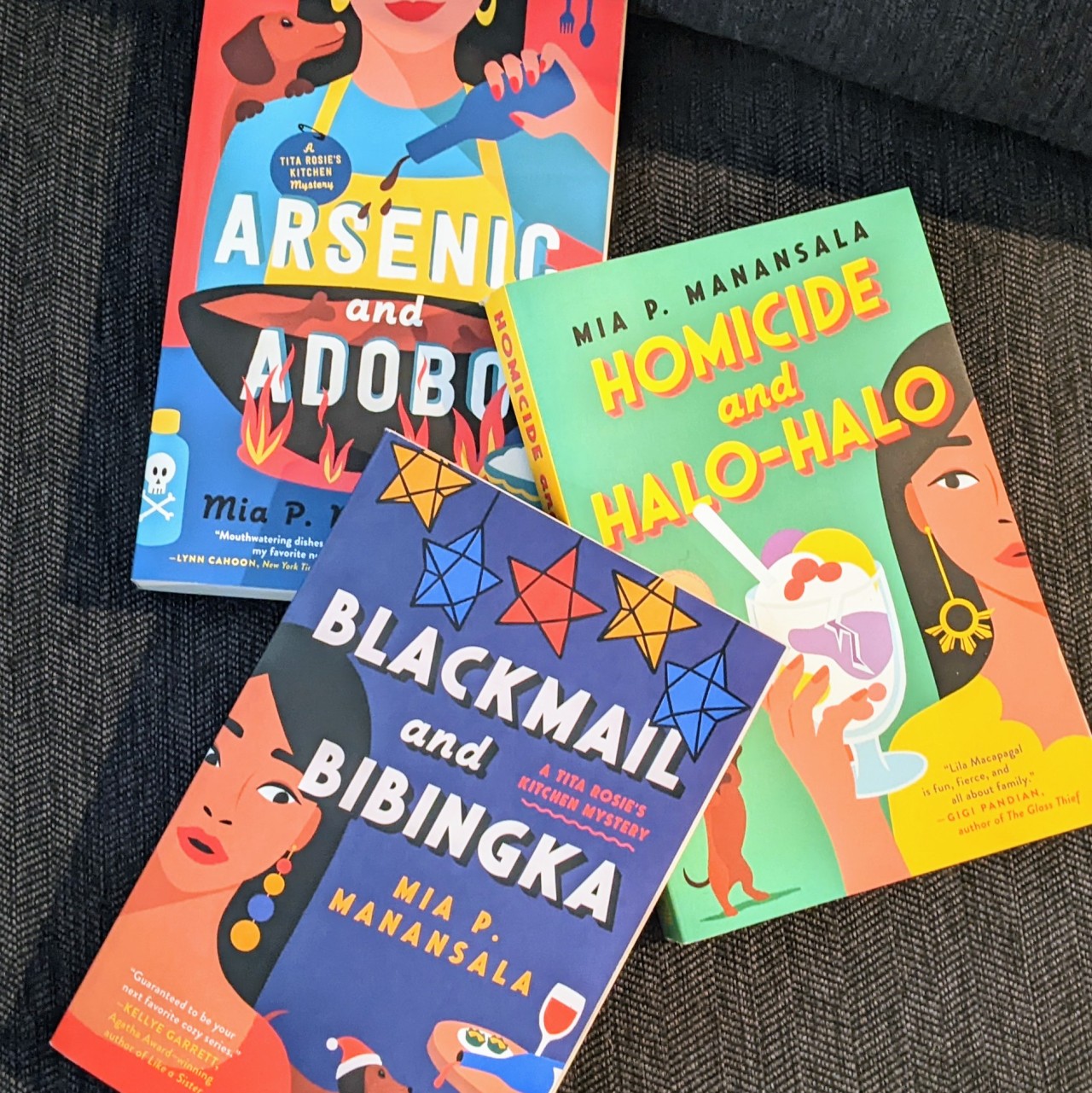 A photo of three book covers for Mian P. Manansala's mystery novels, Arsenic and Adobo, Homicide and Halo-Halo, and Blackmail and Bibingka.