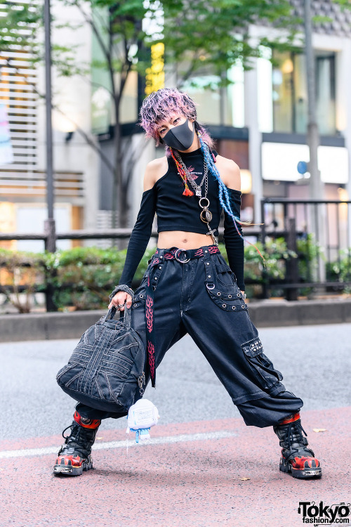 Japanese hair stylist Isana on the street in Harajuku. He&rsquo;s wearing a Never Mind the XU crop t