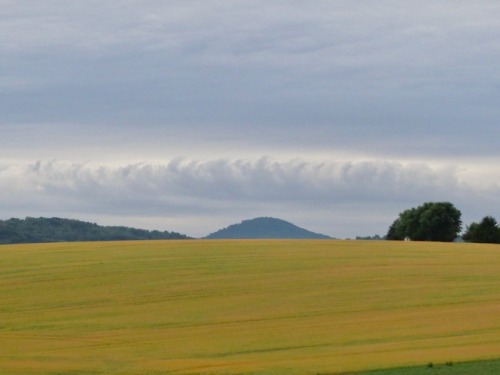 geopsych:I was taking a picture while I was leaving and noticed some odd clouds in the sky over Spitzenberg Hill. There must be a front coming in.