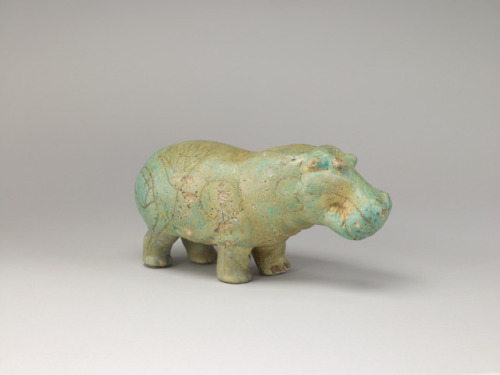 Statuette of a Hippopotamus This figure of a hippo was molded in faience, a crushed quartz glazed an