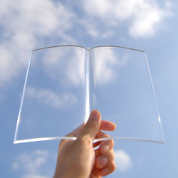 utilitarianthings:  ‘Book on Book‘ is a transparent paperweight that holds down the pages of a novel. It keeps the pages from flipping and allows the user to eat, drink, or sit back while reading. 