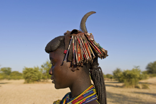 Mucawana women of AngolaMucawana women use cow dung and fat as well as beads to fashion their unique