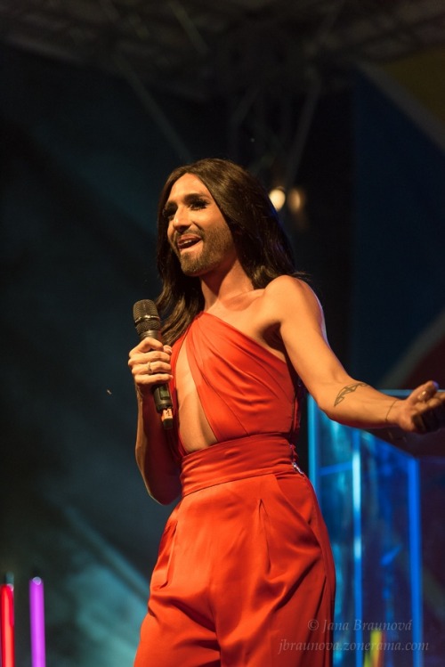 August 10, 2015Conchita at the opening concert of the 5th Prague Pride in a red silk jumpsuit from C