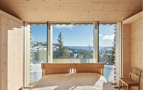 same place with a different weather conditions Skigard Hytte by Mork Ulnes Architects