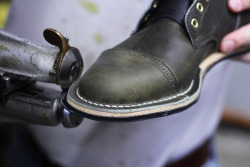 boots, denim, and one headlight