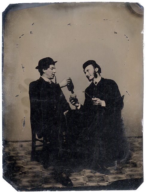 tuesday-johnson:  ca. 1860-90s, [tintype portrait of a man sharing the last of his drink with the ot