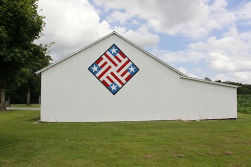 Thornton 1749 Lassiter Rd Murray KY 8x8 Patriotic
This stars and stripes barn quilt is just east of Murray. The family held a picnic on Flag Day 2015 to dedicate this quilt.
We learned about the history of the family and the farm, the patriotism and...