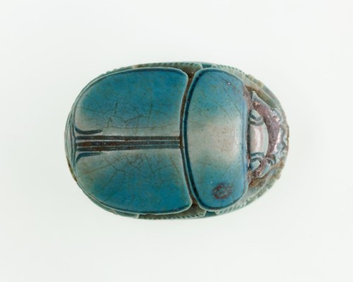 Glazed steatite scarab found with the mummy of one Hatnefer.  Artist unknown; ca. 1492 –1473 BCE (la