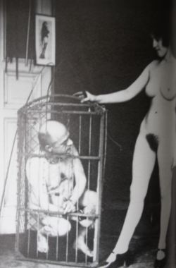 seductivedomme:  pittprickel:   MISTRESS WITH SLAVE PET IN CAGE - Vintage Photo, 1920s  This is so interesting! I’d love to see more vintage femdom porn. 