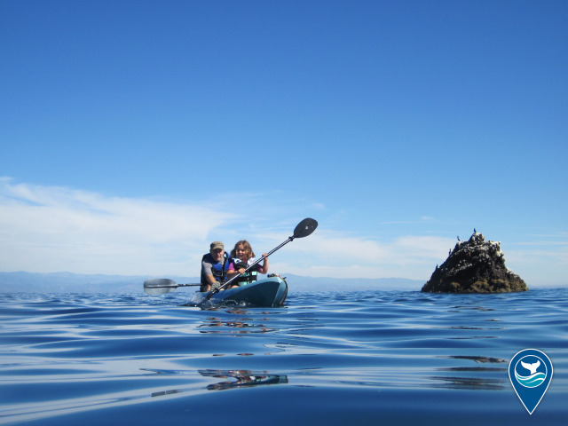 A girl kayaks with her father in Channel Islands National Marine Sanctuary.