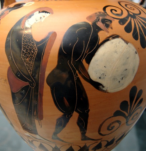 Sisyphus hauls his rock in the Underworld, while Persephone watches.  Side A of an Attic black-