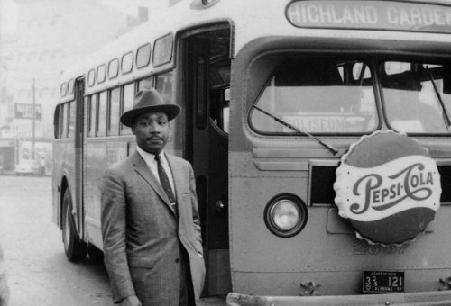 notevenpastuthistory:  Martin Luther King Jr. stands in front of a bus at the end of the Montgomery bus boycott. Montgomery, Alabama December 26, 1956. (Photo Credit: Time & Life Pictures/Getty Images) Martin Luther King Jr is arrested by two white