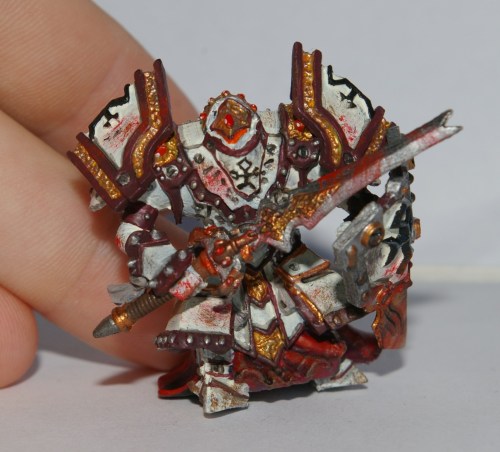 Number four, Pyotr Vadik Zolmow, has his roots in Khador, as his red cloak represents. He is a bulky