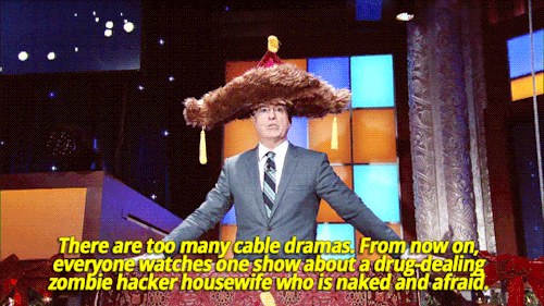 sandandglass:Stephen Colbert issues proclamations whilewearing his big furry hat