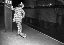 peerintothepast:  Clown waiting for a ride. New York subway. 