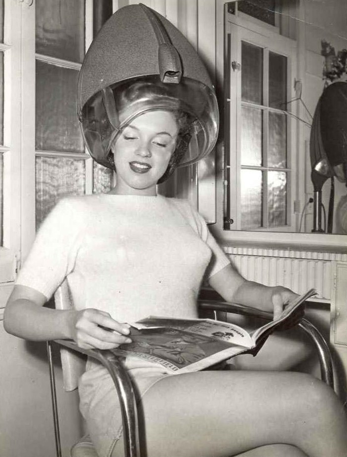 vintagechampagnefever:  A young Marilyn Monroe having her hair set  