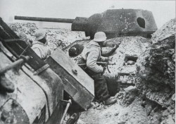 enrique262:  German soldiers using a destroyed T-34 as cover. 