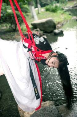 bondagethings:  red roped girl hanged outdoor