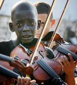 himynameisrollin:  beautifulblackmen:  yagazieemezi:  DAILY INSPIRATION: “The boy who cries in the photo is Diego Frazao Torquato, who played the violin in the String Orchestra of the Afro Reggae. Afro Reggae is a non-profit organization that gives