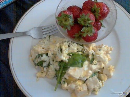 garlic crusted tofu, spinach, spiced mozarella in olive oil scrabled eggs and fresh strawberries for