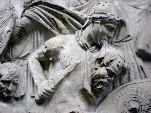 stickfiguregods:leradr:Trajan’s Column. A roman warrior is fighting while is carrying&nbs