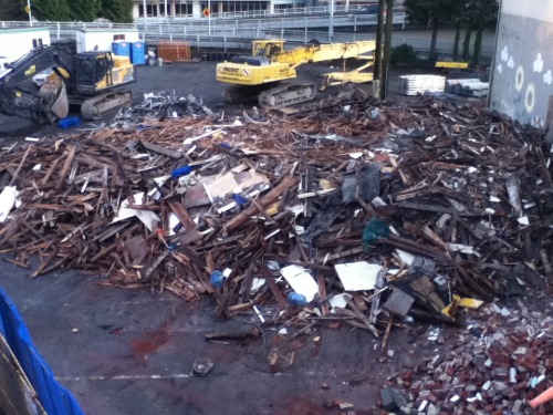 Talking about moving old homes reminded me of this: an old hotel being demolished downtown, to make 