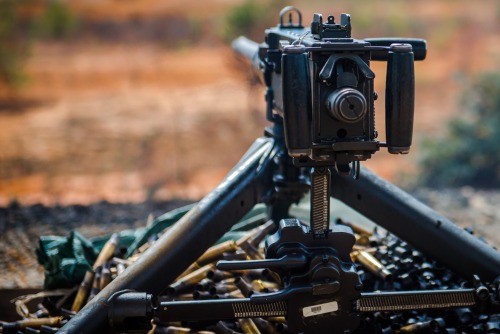 militaryarmament: Trainees firing the Browning M2 from the seated, tripod mounted position as instru