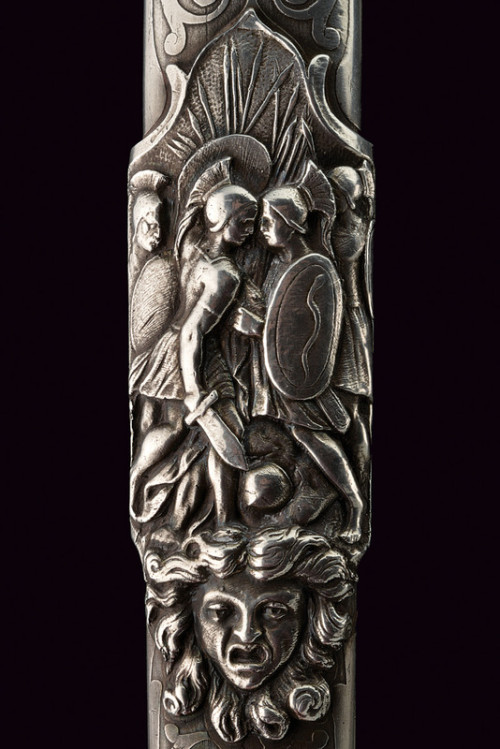 art-of-swords:  “Heroic Style” Silver Mounted DaggerDated: 19th centuryCulture: EuropeanMeasurements: height 64cmThe dagger has a straight, double-edged blade with three fullers. The massive, silver hilt has its the grip worked as the in-the-round