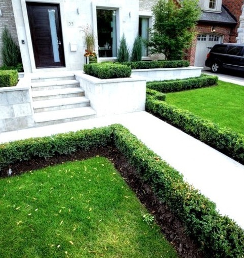 Toronto Front Yard Natural Stone PaversPhoto Of A Mid-sized Contemporary Partial Sun Front Yard Stone