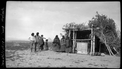 pogphotoarchives:[Jenethle Chee]’s camp?, showing Navajo family with loom and summer shelter, 