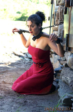 mistresssonjablue:  graybandanna:  Yoked and chained in her pretty red dress  Not quite what she expected hen I invited her to my cabin for the weekend. But at least I enjoyed it. 