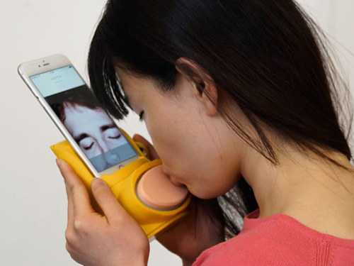 The Kissenger smartphone adapter helps you avoid “awkward kiss blowing” over the phone and allows yo