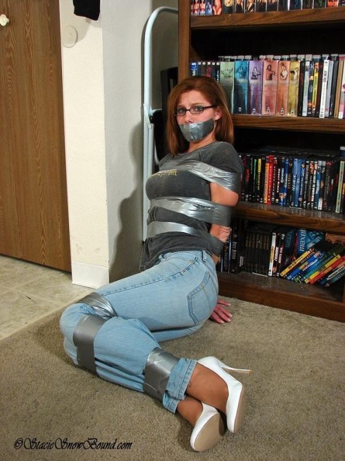 All you really need for good bondage pictures is a pretty model and a roll of the classic silver duct tape.
