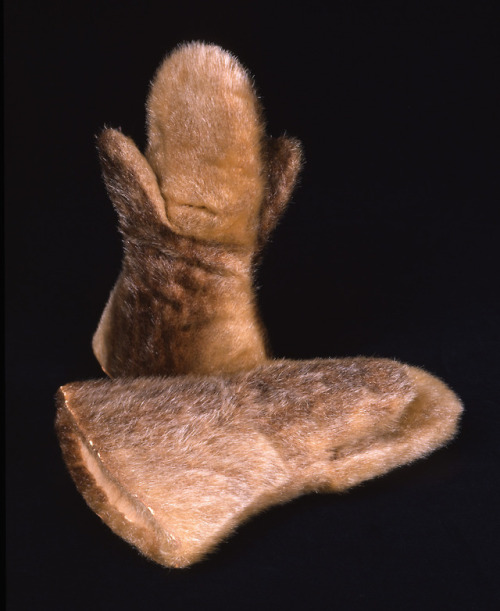 Kalaallit (West Greenlandic Inuit) double-thumbed sealskin and dog fur mitts, ca. 1897.Like carrying