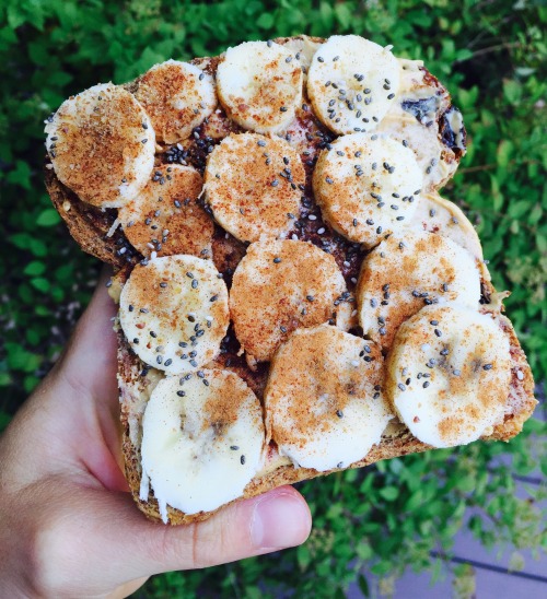 pnut-butter:Cinnamon Raisin Ezekiel bread with peanut butter, banana coins, cinnamon, ground flax se