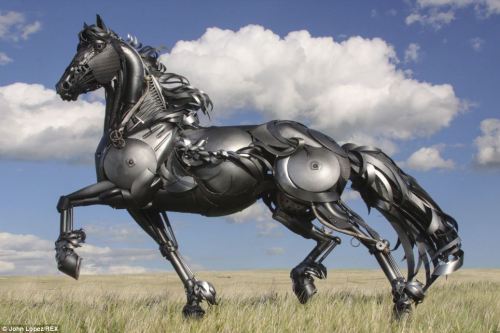 iwanttoberecycled:  archiemcphee:  South Dakota-based artist John Lopez (previously featured here) creates awesome life-size sculptures of animals by welding together pieces of scrap metal, often pieces of abandoned farm machinery collected from local