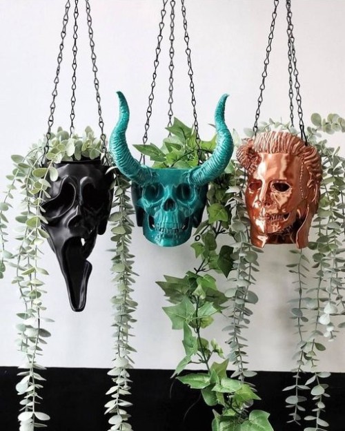 Some cool hanging planters. mayhemmade.com #movie villain planters #goth planters#cool finds