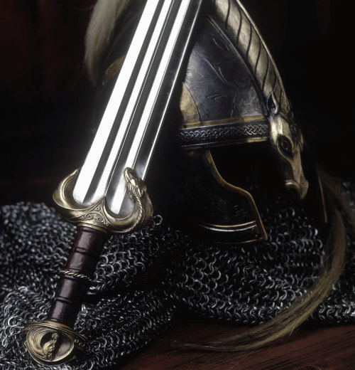 ramblingrivers:Beautiful helmet and swords that look like they belong in a museum instead of an armo