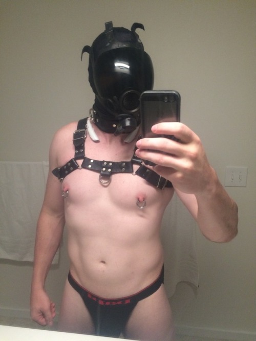 Drone houseboy gear:  Household drone chore uniform: Inner hood Gas mask Bluetooth headphones  Collar Black harness Nipple rings Chastity Jock strap  Knee pads